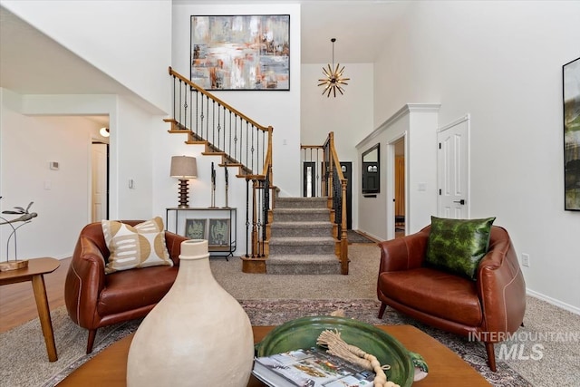 511 Keogh Ln, Caldwell, ID 83607 - carpeted living area featuring a towering ceiling, stairs, and baseboards