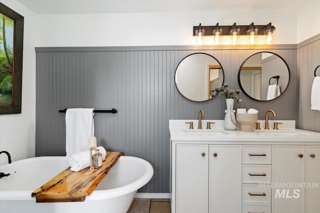 511 Keogh Ln, Caldwell, ID 83607 - full bath featuring double vanity, a soaking tub, and tile patterned floors