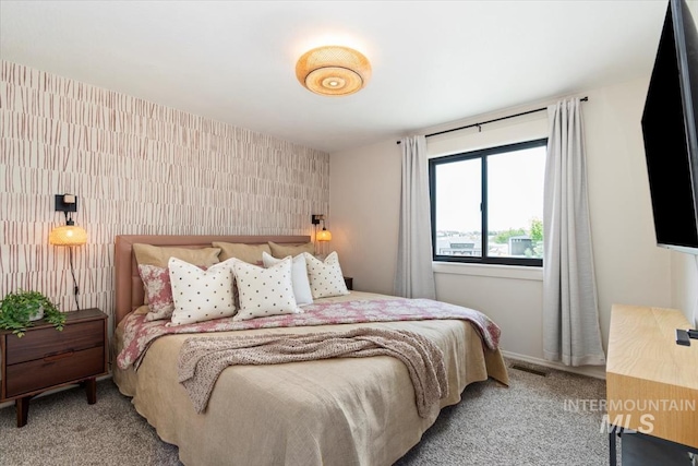 511 Keogh Ln, Caldwell, ID 83607 - carpeted bedroom featuring an accent wall
