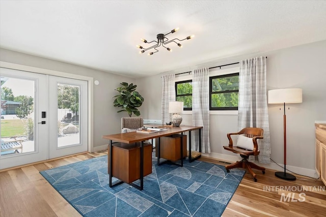 511 Keogh Ln, Caldwell, ID 83607 - office area with dark wood finished floors, baseboards, and french doors