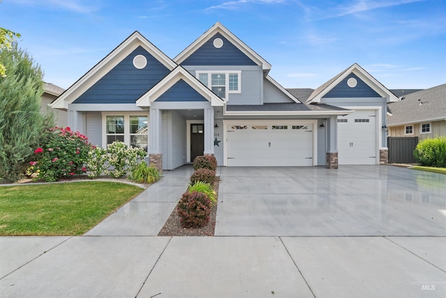5404 S Palatino Ave, Meridian, ID 83642 - view of front facade featuring stone siding, concrete driveway, a garage, and a front lawn