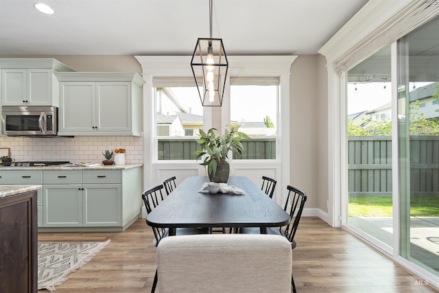 5404 S Palatino Ave, Meridian, ID 83642 - dining room featuring light wood finished floors and recessed lighting