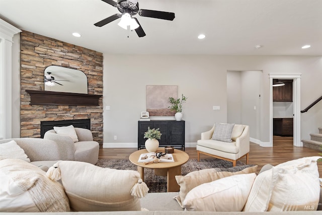 5404 S Palatino Ave, Meridian, ID 83642 - living room featuring ceiling fan, stairs, wood finished floors, a fireplace, and recessed lighting