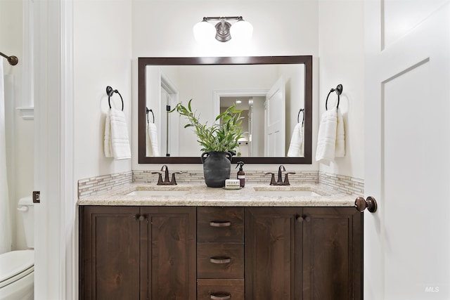 5404 S Palatino Ave, Meridian, ID 83642 - bathroom featuring double vanity and toilet