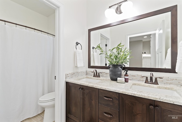 5404 S Palatino Ave, Meridian, ID 83642 - bathroom featuring double vanity and toilet