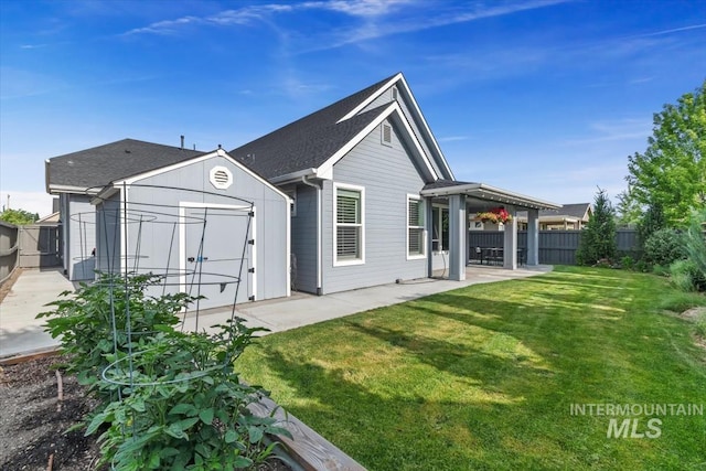 5404 S Palatino Ave, Meridian, ID 83642 - rear view of house with a patio area, a shed, and a shingled roof
