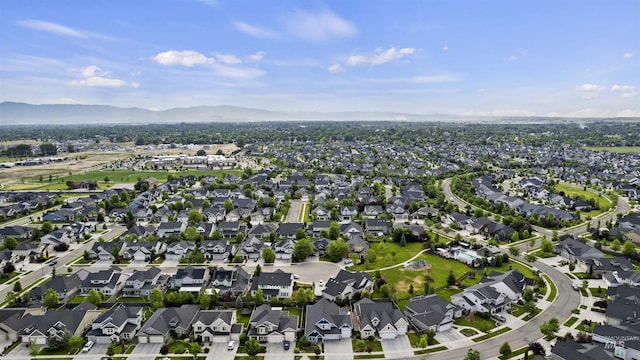 5404 S Palatino Ave, Meridian, ID 83642 - aerial overview of property's location with a mountainous background and nearby suburban area