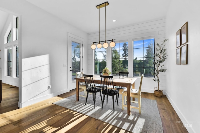 dining area featuring dark wood-type flooring, baseboards, and recessed lighting