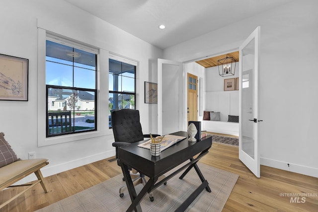 office area featuring light wood finished floors, baseboards, a chandelier, and recessed lighting