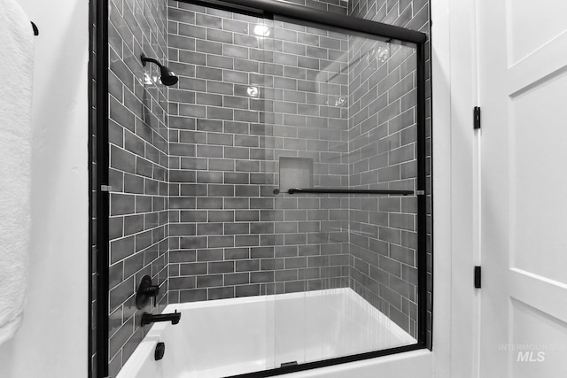 bathroom featuring enclosed tub / shower combo