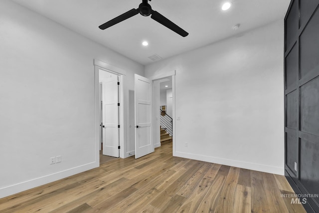 unfurnished bedroom with baseboards, light wood-type flooring, recessed lighting, and ceiling fan
