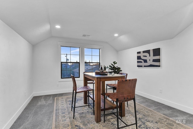 carpeted dining room featuring vaulted ceiling, baseboards, and recessed lighting