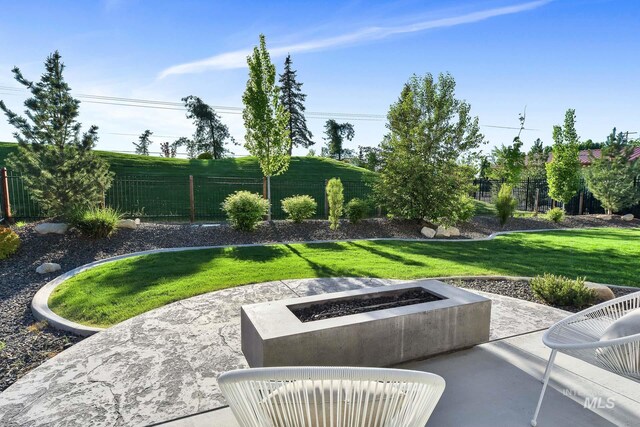 view of patio / terrace featuring a fire pit