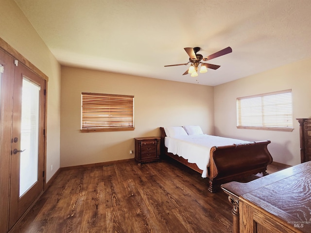 bedroom featuring french doors, ceiling fan, and dark wood-type flooring