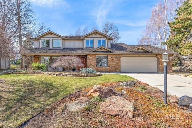 view of front of property featuring an attached garage, driveway, and a front lawn