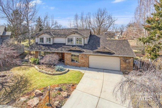 traditional-style home featuring driveway, a front yard, and an attached garage