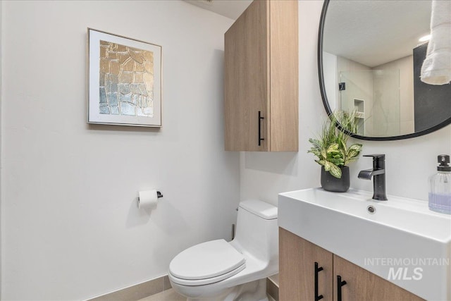 bathroom with toilet and vanity