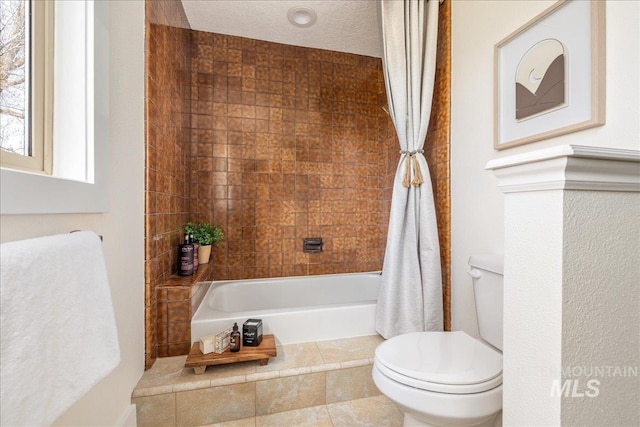 bathroom with toilet and shower / bath combo