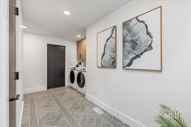 laundry area featuring light tile patterned floors, baseboards, recessed lighting, cabinet space, and washer and clothes dryer