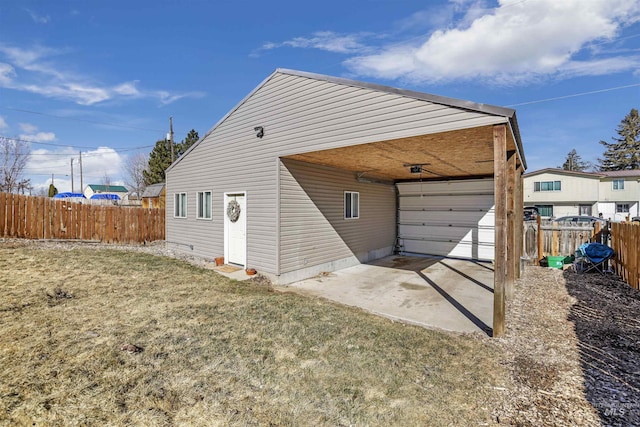 exterior space with driveway and fence