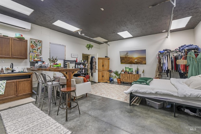 interior space featuring concrete floors and a wall mounted AC