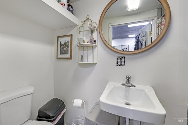 bathroom with a sink and toilet