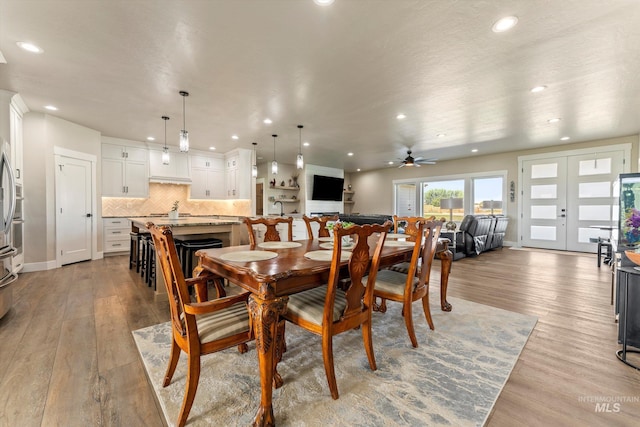 6623 Red Rock Rd, Marsing, ID 83639 - dining space with recessed lighting, wood finished floors, a ceiling fan, baseboards, and french doors