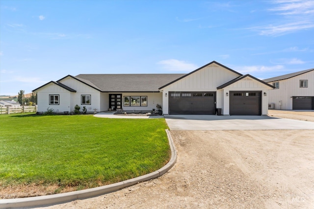 6623 Red Rock Rd, Marsing, ID 83639 - modern farmhouse with concrete driveway, board and batten siding, a garage, and roof with shingles