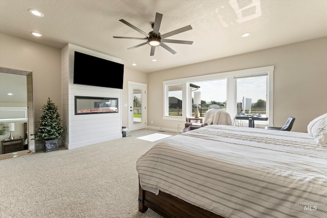 6623 Red Rock Rd, Marsing, ID 83639 - carpeted bedroom with access to exterior, recessed lighting, a fireplace, and a ceiling fan
