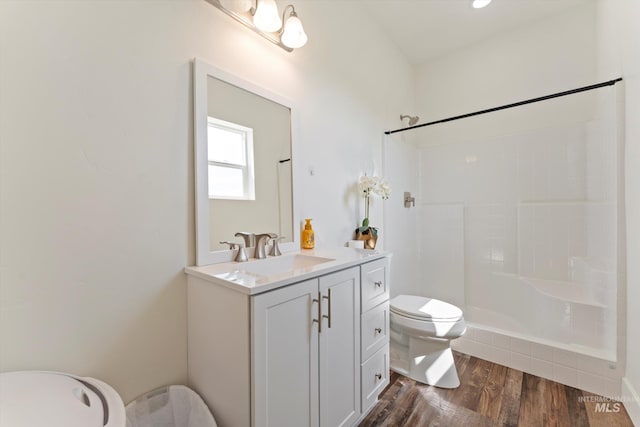 6623 Red Rock Rd, Marsing, ID 83639 - full bath with toilet, tiled shower, vanity, and wood finished floors