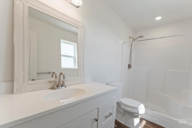 6623 Red Rock Rd, Marsing, ID 83639 - full bath featuring toilet, vanity, tiled shower, and wood finished floors