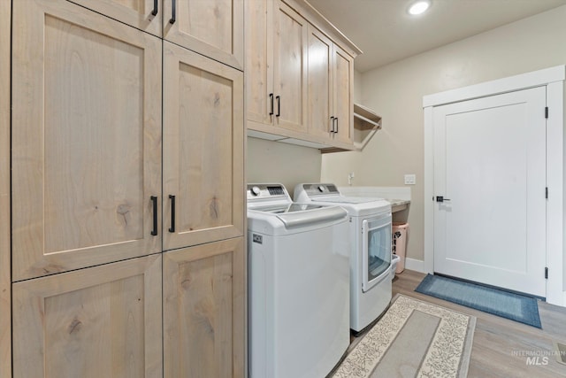 6623 Red Rock Rd, Marsing, ID 83639 - laundry area with cabinet space, washer and clothes dryer, light wood finished floors, and recessed lighting