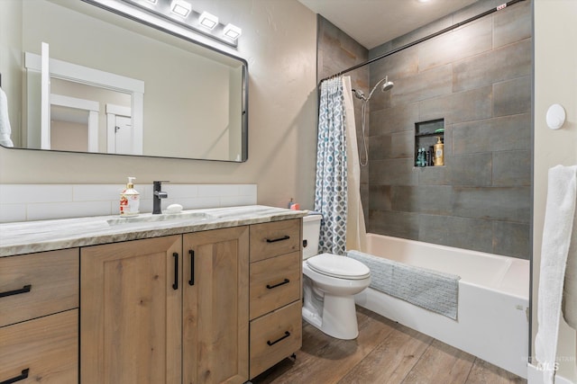 6623 Red Rock Rd, Marsing, ID 83639 - full bathroom featuring vanity, wood finished floors, shower / bath combination with curtain, and toilet