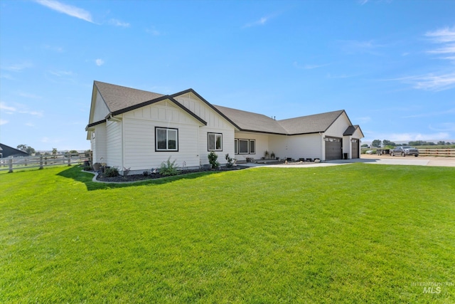6623 Red Rock Rd, Marsing, ID 83639 - view of front of home with board and batten siding, driveway, and an attached garage