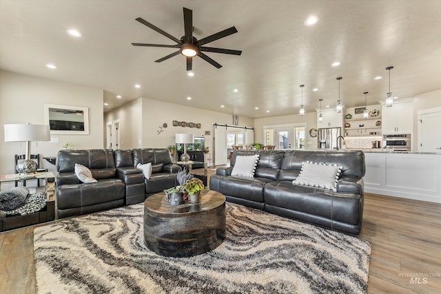 6623 Red Rock Rd, Marsing, ID 83639 - living area featuring a ceiling fan, wood finished floors, and recessed lighting