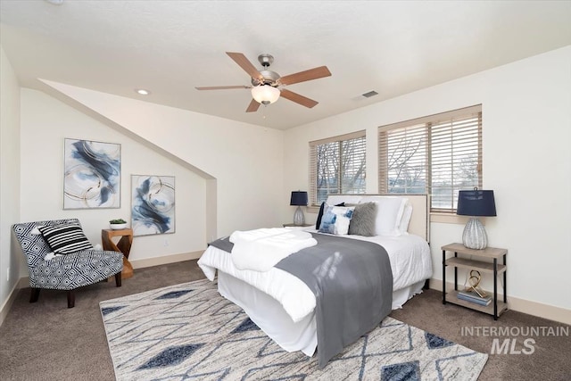 carpeted bedroom with baseboards, visible vents, and ceiling fan