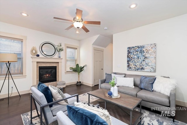 living area featuring recessed lighting, baseboards, and wood finished floors