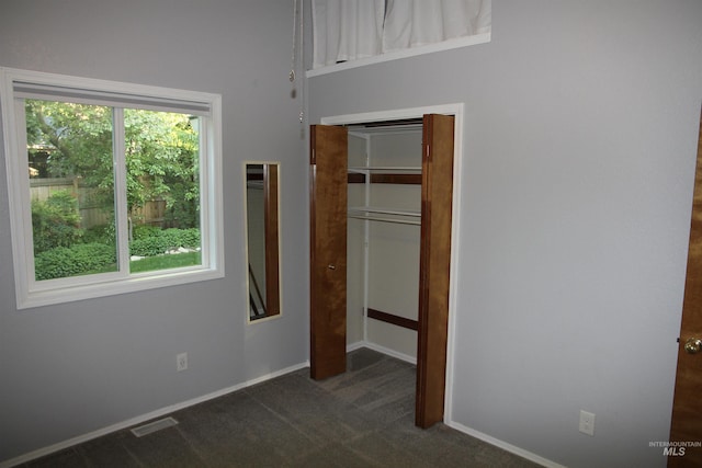 225 E Bayview, Boise, ID 83706 - unfurnished bedroom with dark carpet and baseboards