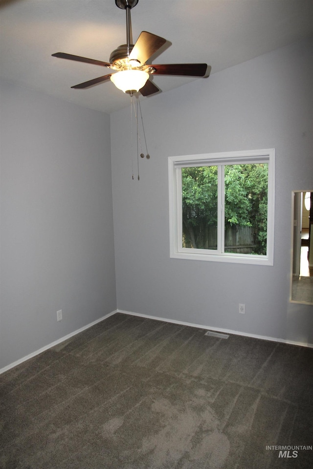 225 E Bayview, Boise, ID 83706 - empty room with ceiling fan, dark carpet, and baseboards