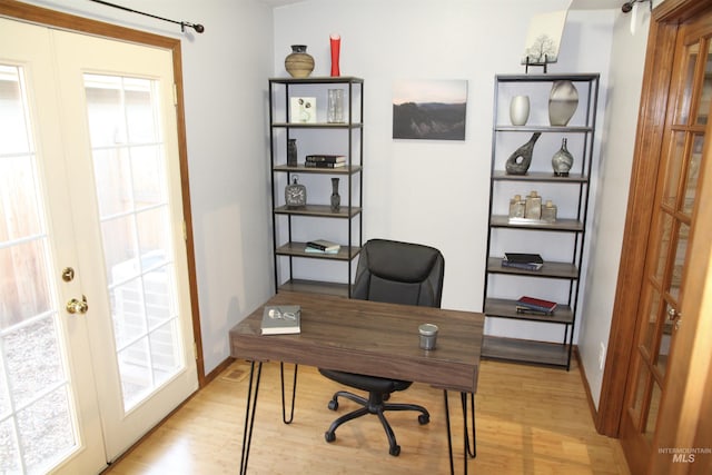 225 E Bayview, Boise, ID 83706 - office space featuring light wood-type flooring, plenty of natural light, and french doors