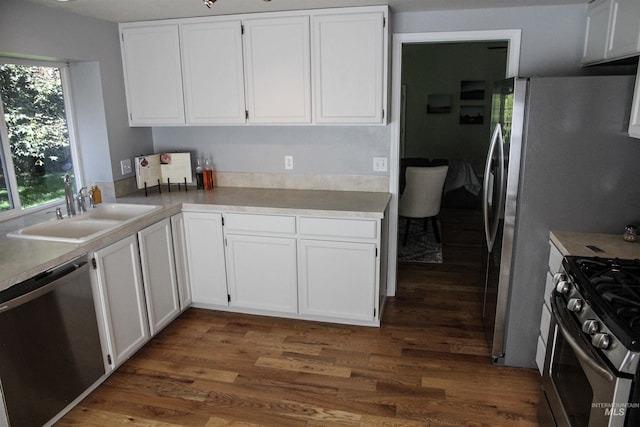 225 E Bayview, Boise, ID 83706 - kitchen featuring a sink, dishwasher, white cabinets, gas range, and dark wood-style floors