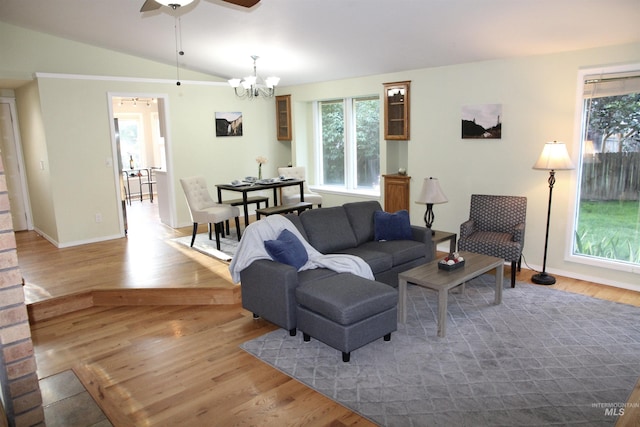 225 E Bayview, Boise, ID 83706 - living area featuring a ceiling fan, lofted ceiling, a chandelier, wood finished floors, and baseboards
