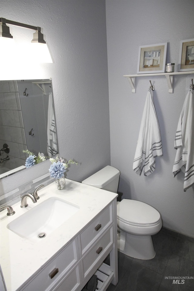 225 E Bayview, Boise, ID 83706 - bathroom featuring toilet, vanity, and tile patterned floors