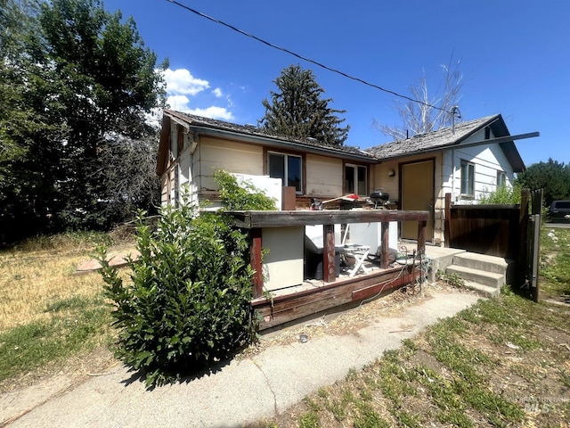 1033 Nevada St, Gooding, ID 83330 - view of front of house featuring a wooden deck
