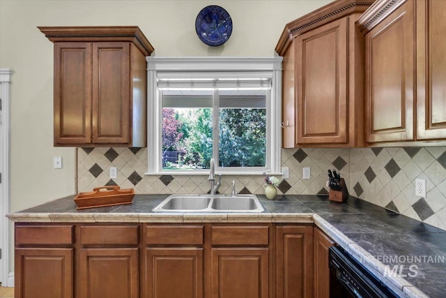 2627 E Moog St, Meridian, ID 83646 - kitchen featuring a sink, decorative backsplash, and brown cabinetry