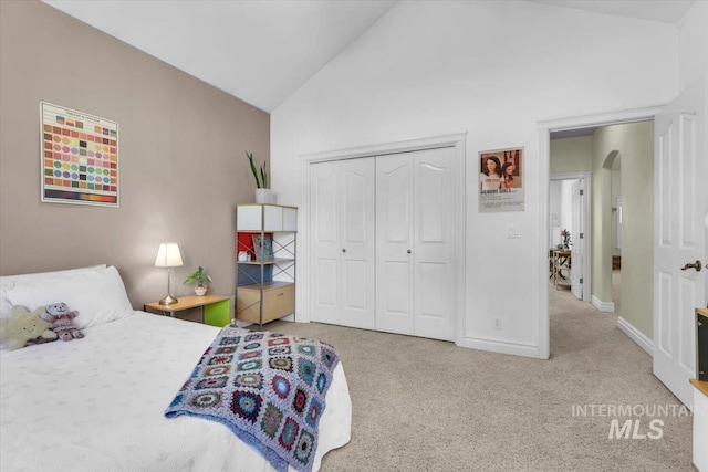 2627 E Moog St, Meridian, ID 83646 - bedroom featuring high vaulted ceiling, carpet, baseboards, a closet, and arched walkways