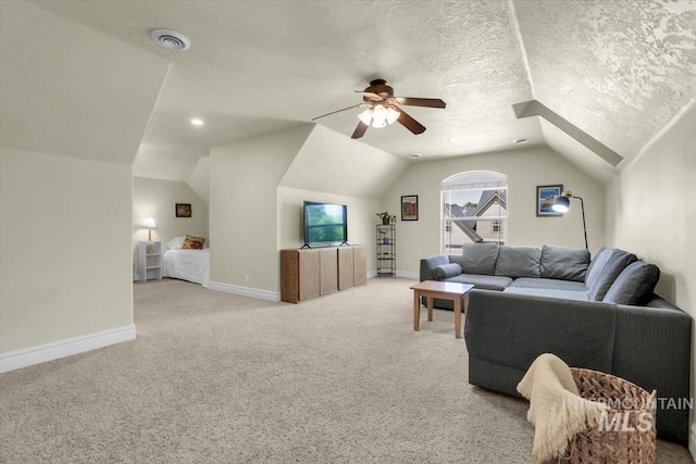 2627 E Moog St, Meridian, ID 83646 - living area with vaulted ceiling, light colored carpet, ceiling fan, a textured ceiling, and baseboards