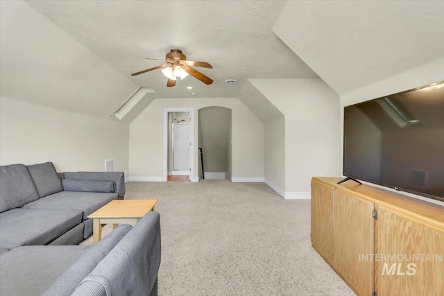 2627 E Moog St, Meridian, ID 83646 - living area with a ceiling fan, light carpet, vaulted ceiling, and baseboards