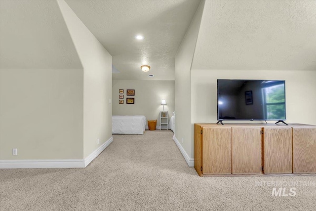 2627 E Moog St, Meridian, ID 83646 - carpeted living area featuring a textured ceiling and baseboards