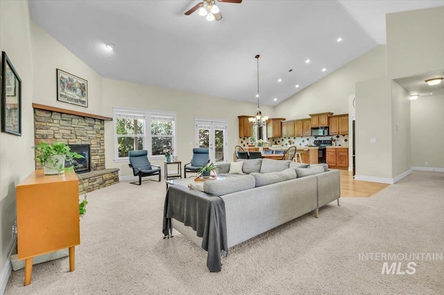 2627 E Moog St, Meridian, ID 83646 - living room with light colored carpet, ceiling fan, a stone fireplace, baseboards, and high vaulted ceiling